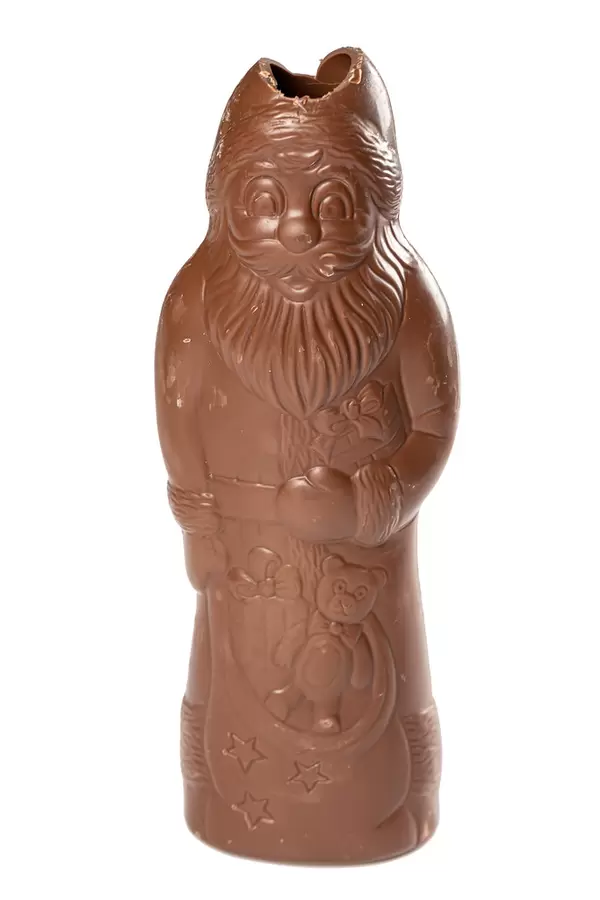Partly eaten chocolate santa claus over white background