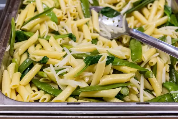 Pasta with sugar peas, kohlrabi, onions, green asparagus and almonds at the lunch buffet in the AXA building in Cologne, at the Barcamp OMWest19