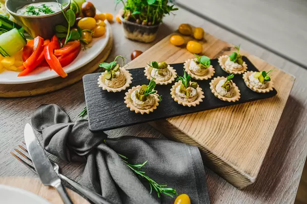 Pastry Canapes With Cream And Greens