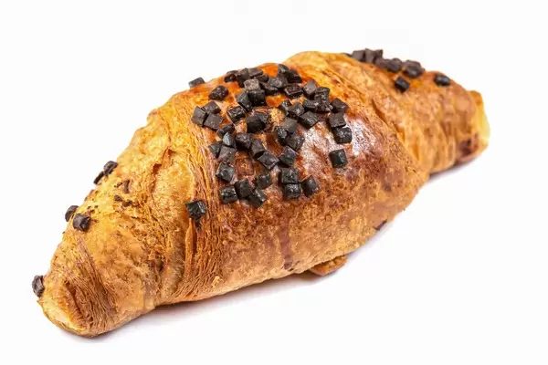 Pastry Croisant with Chocolate Crumbs above white background (Flip 2019)