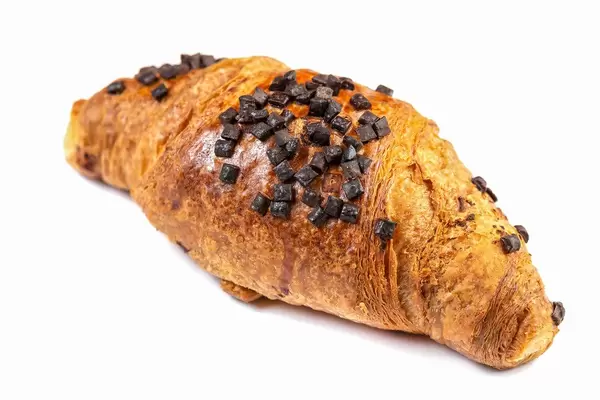 Pastry Croisant with Chocolate Crumbs above white background