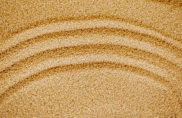 Pattern on the yellow sand