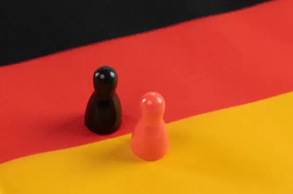 pawn figurines on German flag