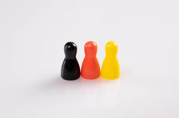 Pawn figurines on white background