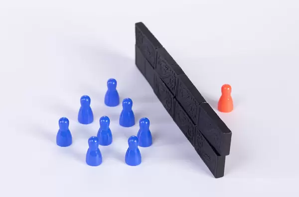 Pawns and wall on white background