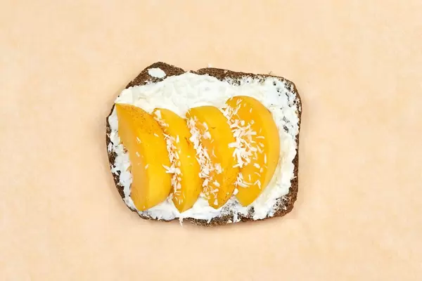 Peach fruit sandwich on bright background