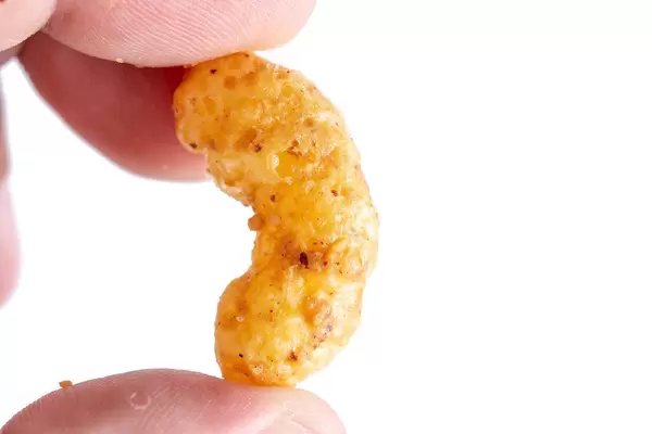 Peanuts Snacks in the hand above white background