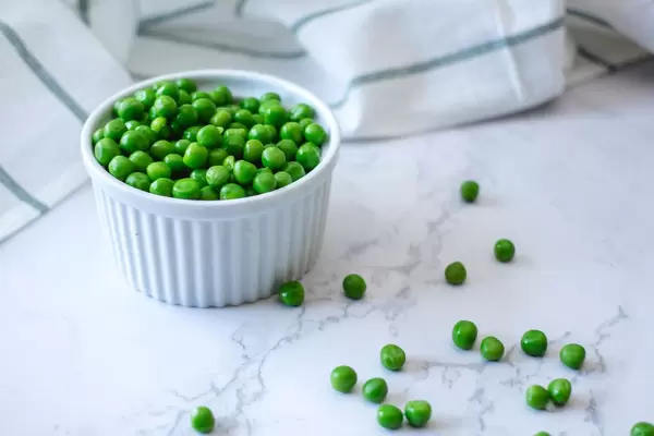 Peas in a White Bowl