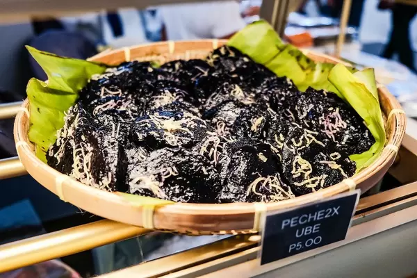 Peche ube with cheese toppings on display