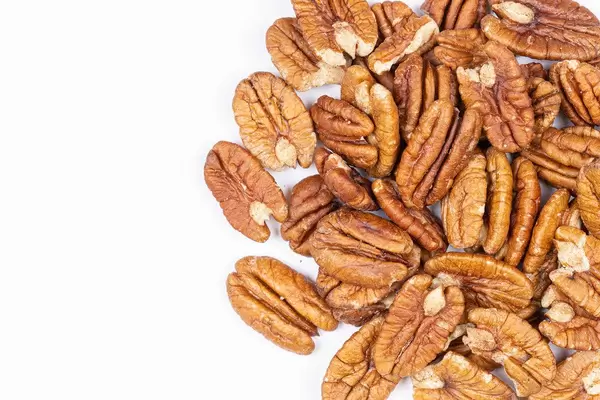 Peckans Nuts with copy space above white background