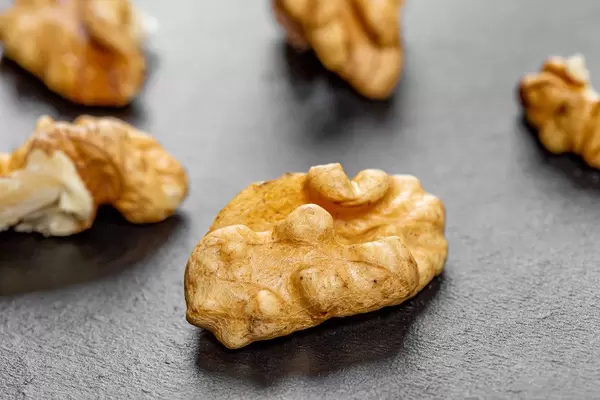 Peeled Walnuts on black background