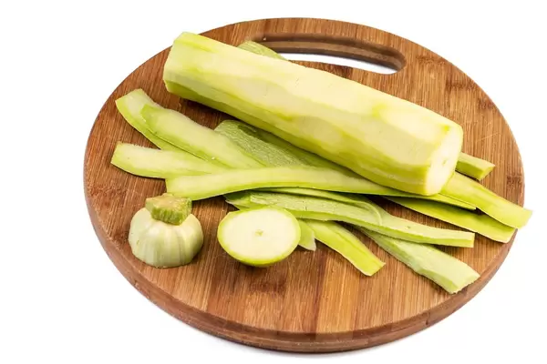 Peeled Zucchini on the wooden board