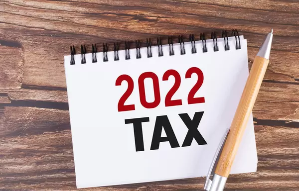 Pen and notebook wtih 2022 Tax text