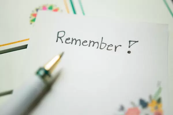 Pen pointing to REMEMBER