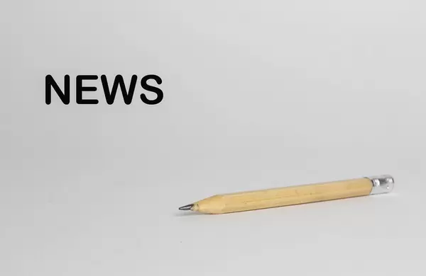 Pencil with news text