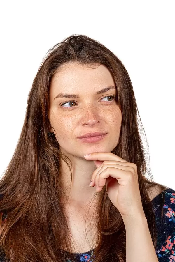 Pensive face of a brunette girl