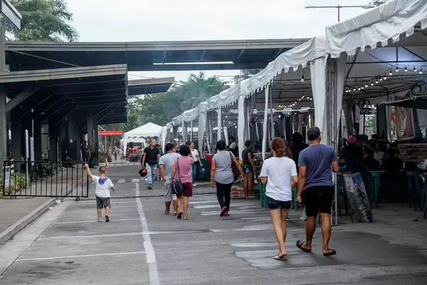 People checking out the local dishes at a food park (Flip 2019)
