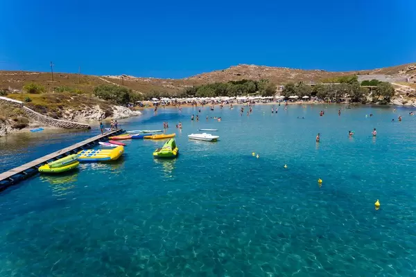 People during summer vacation swimming in the Mediterranean Sea, in front of Monastiri Beach of Korakas, on the Greek island of Paros