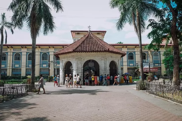 People gathering at the famous Magellan's Cross