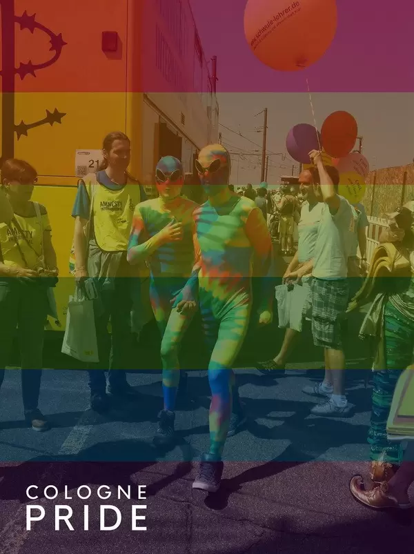 People in full body suites in rainbow colors during gay parade "Cologne Pride"