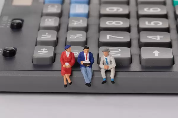 People sitting on calculator