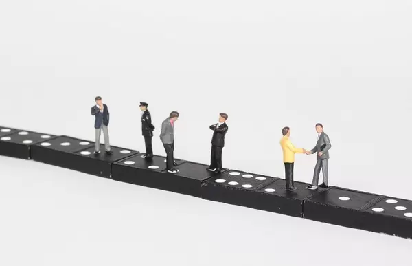 People standing and talking on dominoes