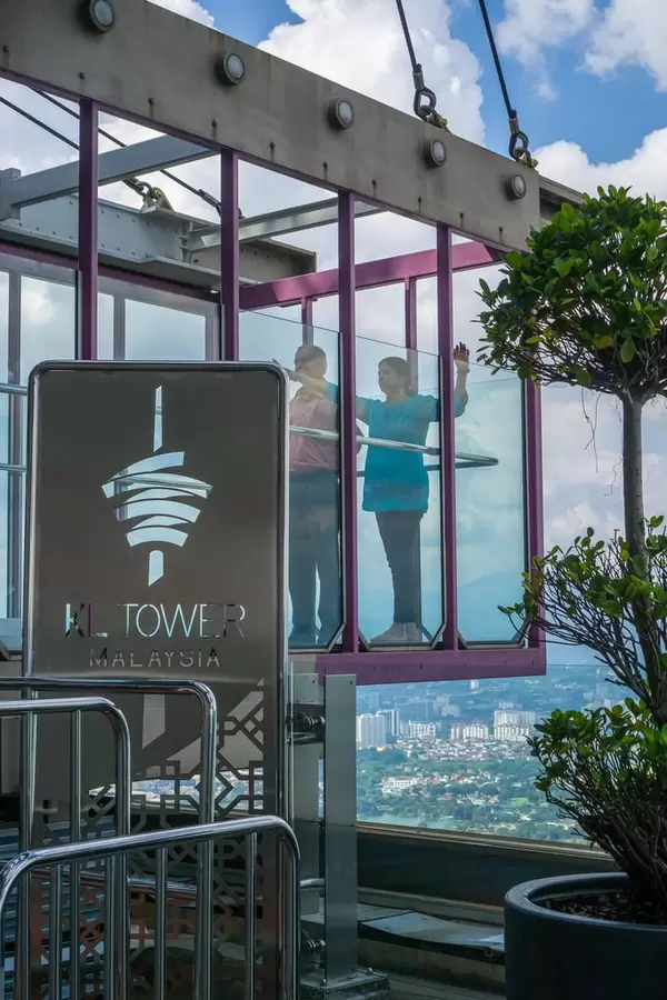 People standing in the Sky Box of KL Tower in Kuala Lumpur