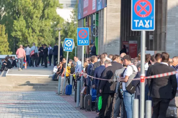 People waiting for Taxi at fairground in Berlin