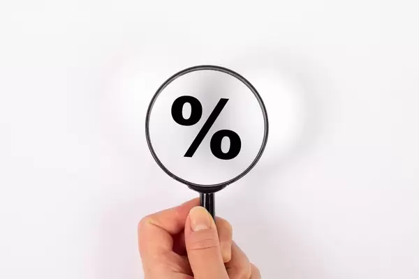 Percentage symbol under magnifying glass