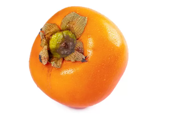 Persimmon fruit on white, close up