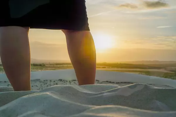 Person Watching the Sunset at Golden Hour in the White Sand Dunes of Mui Ne