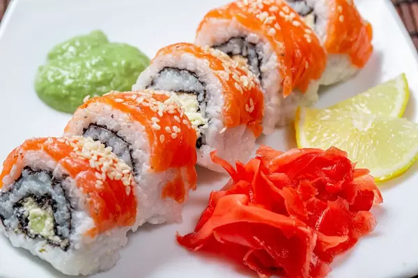 Philadelphia sushi homemade with wasabi, ginger and lemon slices