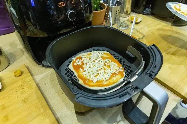 Philips Airfryer XXL Heißluftfritteuse mit Smart Sensor Technologie und Pizza-Kit