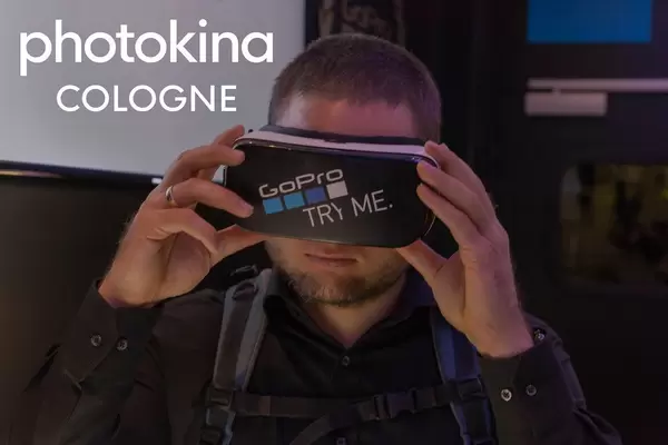 Photo fair visitor tests the VR glasses by GoPro, next to the picture title "photokina Cologne"