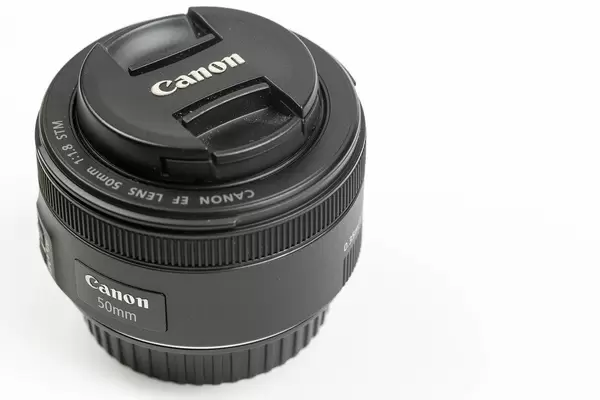 Photographic Canon Prime Lens 50mm f1.8 isolated above white background