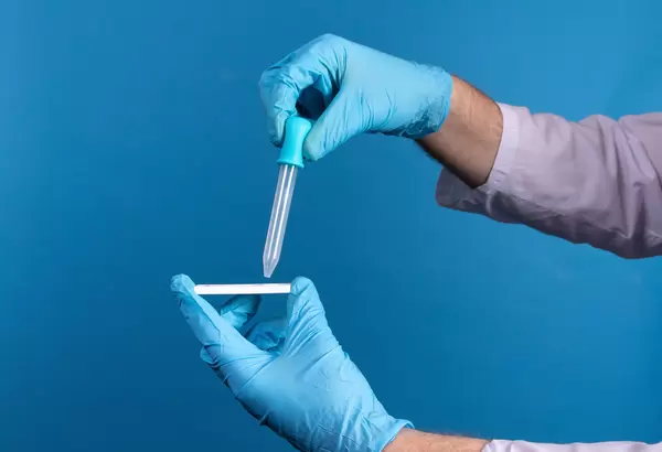 Physician who owns a COVID-19 antigen test kit with a COVID-19 2019-nCoV viral disease test kit