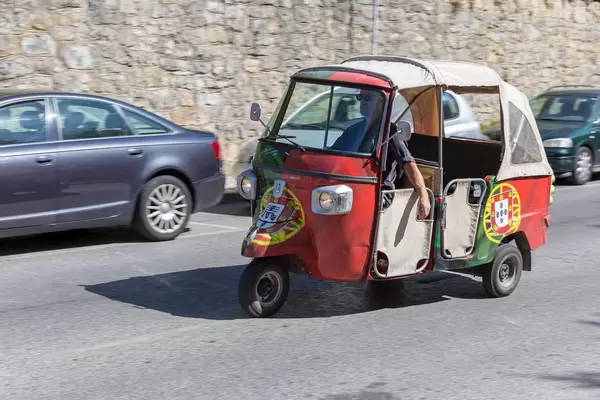 Piaggio Tuk Tuk painted with the flag of Portugal