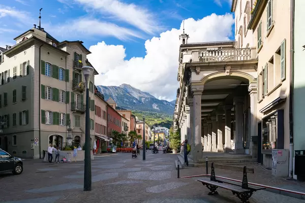 Picturesque view of central street of Sion, Switzerland with epic mountains in the background