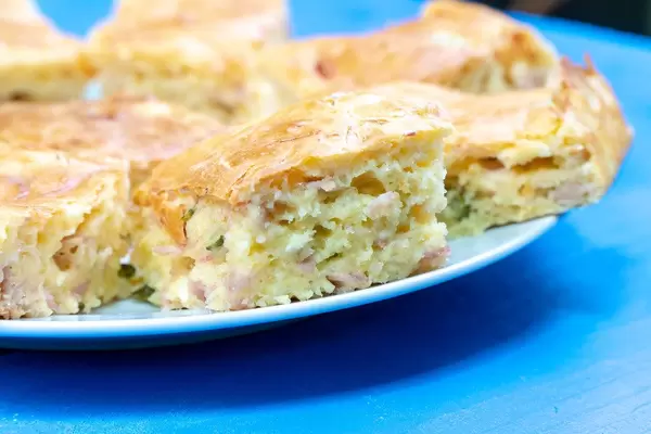 Pie with Cheese and Ham on the plate