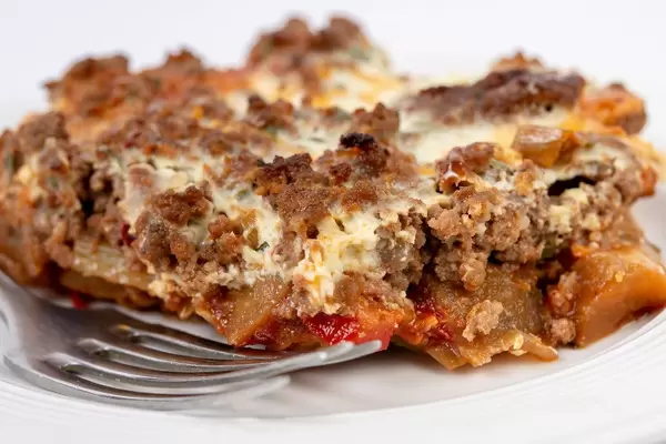 Pie with Eggplant Leek Paprika and Minced Meat on the plate (Flip 2019)