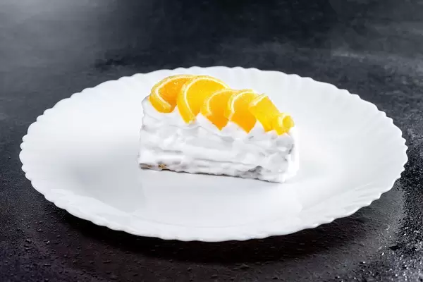 Piece of cake with white cream and citrus marmalade (Flip 2019)
