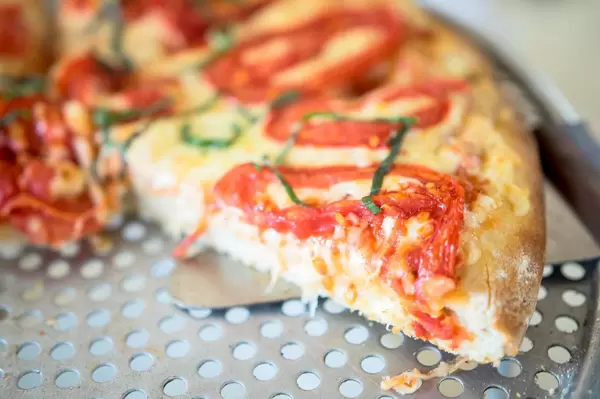 Piece of margarita pizza