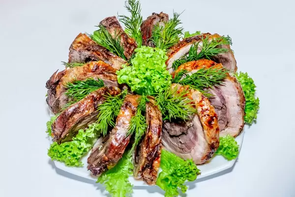 Pieces of baked meat with herbs  Flip 2019