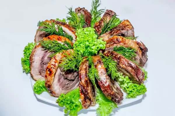 Pieces of baked meat with herbs