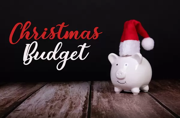 Piggy bank with Christmas hat and Chirstmas Budget text