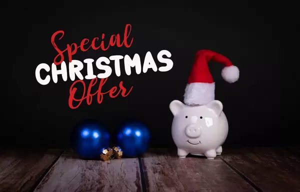 Piggy bank with Christmas hat and Special Christmas Offer text