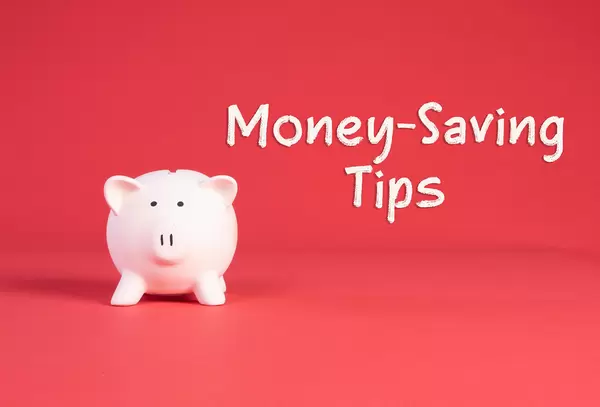 Piggy bank with Money-Saving Tips text on red background