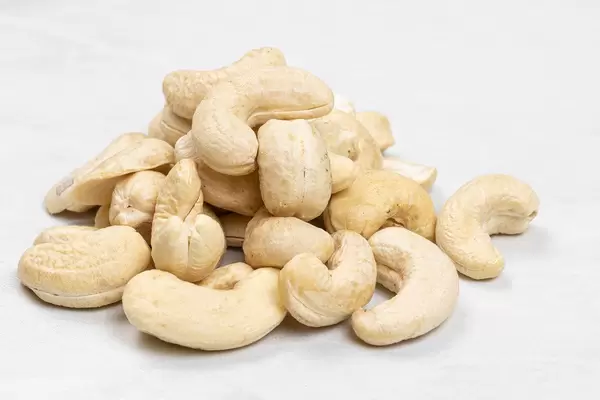 Pile of Cashew nuts on the grey marble table
