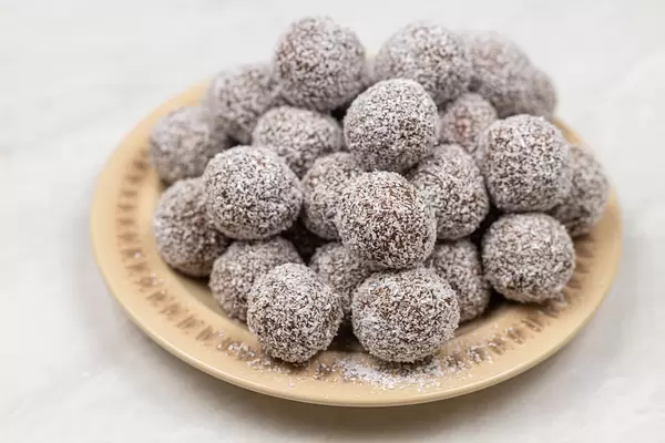 Pile of Chocolate Balls with Coconut on the plate