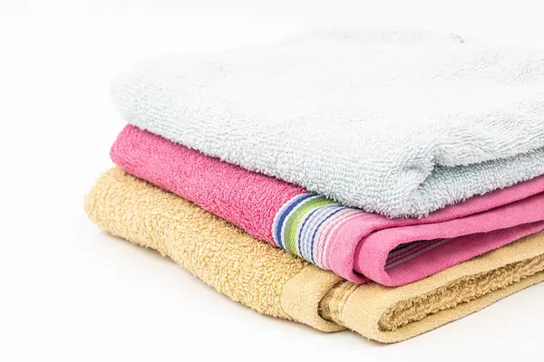 Pile of clean Towels isolated above white background